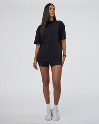 Woman wearing Lifting Club FLXCotton Tee Oversize - Black-White-Red | Model:Rhiley | Size:XS