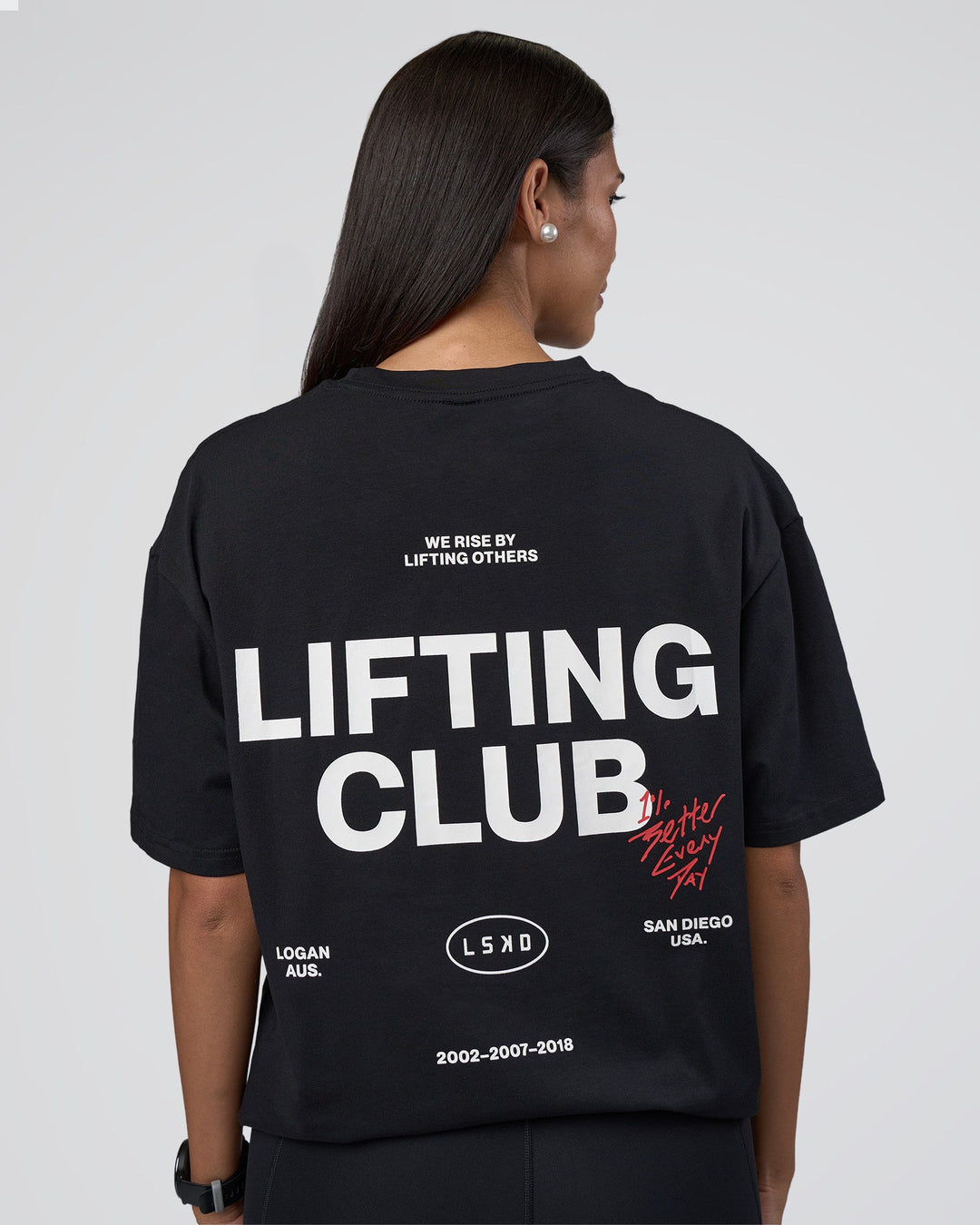 Woman wearing Lifting Club FLXCotton Tee Oversize - Black-White-Red | Model:Rhiley | Size:XS