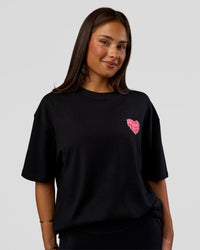 Woman wearing Love the Journey FLXCotton Oversized Tee - Black-Flame | Model:Bianca | Size:XS