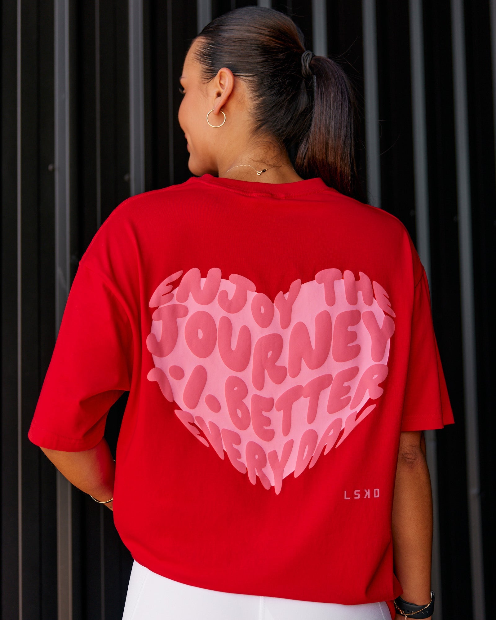 Woman wearing Love the Journey FLXCotton Oversized Tee - Flame-Candy Pink | Model:Shae | Size:XS