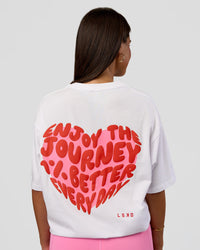 Woman wearing Love the Journey FLXCotton Oversized Tee - White-Candy Pink | Model:Bianca | Size:XS