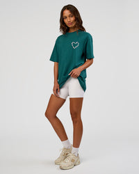 Woman wearing Love The Process FLXCotton Oversize Tee - Transformative Teal-Marshmallow | Model:Dakota | Size:XS