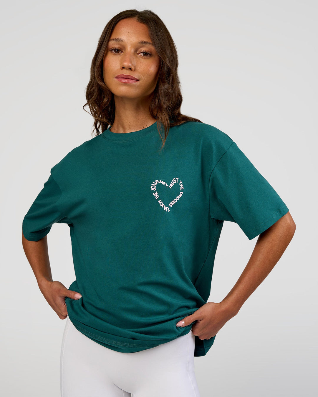 Woman wearing Love The Process FLXCotton Oversize Tee - Transformative Teal-Marshmallow | Model:Dakota | Size:XS