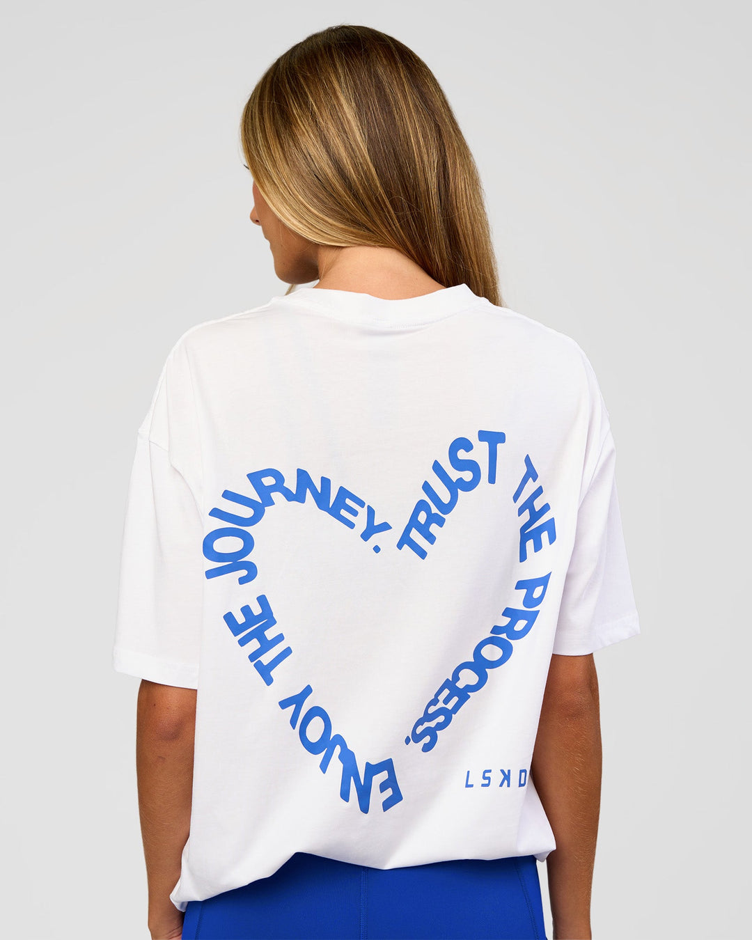 Woman wearing Love The Process FLXCotton Oversize Tee - White-Electric Indigo | Model:Georgia | Size:XS - view 4