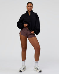 Woman wearing Luxe ZeroCrease Spacer Half Zip - Black | Model:Sophia | Size:XS
