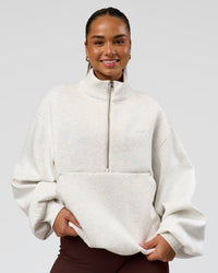 Woman wearing Luxe ZeroCrease Spacer Half Zip - Silver Marl | Model:Sophia | Size:XS