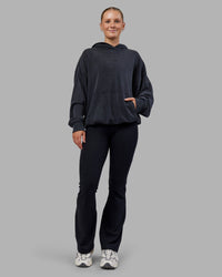 Woman wearing MVP Washed Terry Oversized Hoodie - Black Washed | Model:Neve | Size:XS