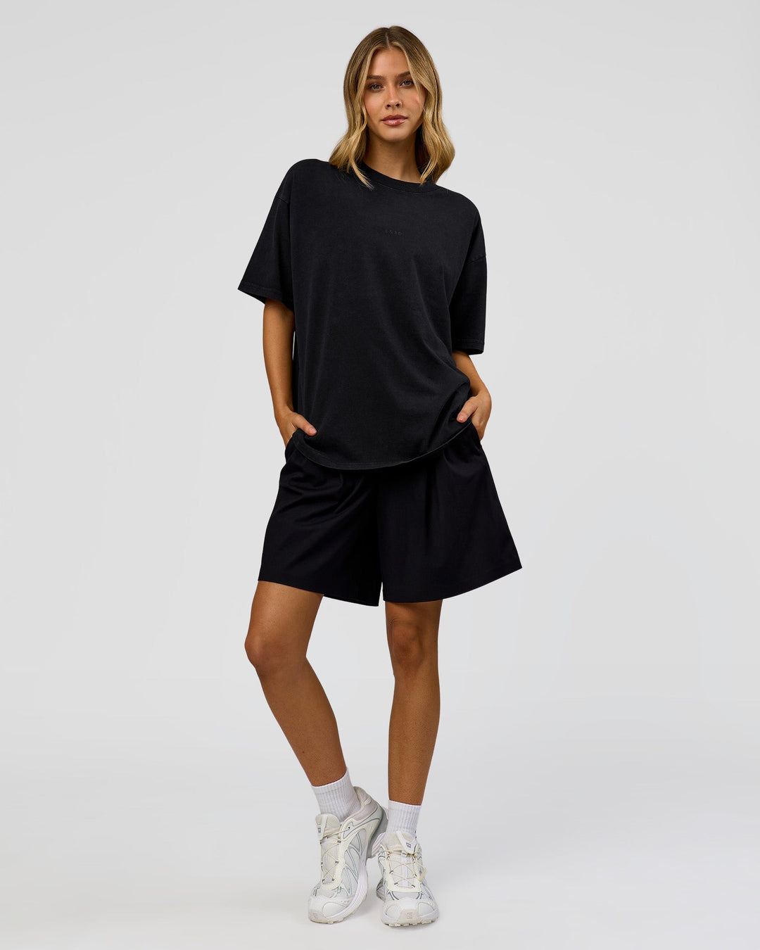Woman wearing Memory in Motion Heavyweight Oversized Tee - Black Washed | Model:Leilani | Size:XS