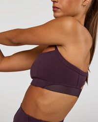 Woman wearing Momentum Corset Sports Bra - Midnight Plum | Model:Brylee | Size:XS