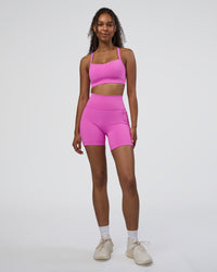 Woman wearing Momentum Sports Bra D/DD/E - Ultra Fuchsia | Model:Jordan | Size:XS