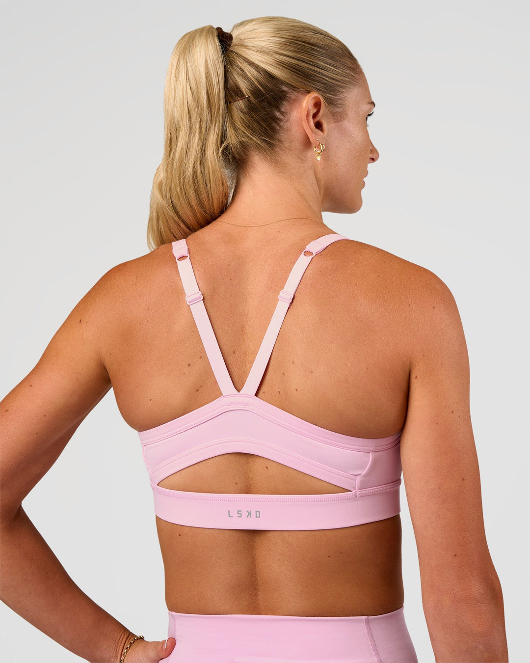 Woman wearing Momentum Sports Bra - Marshmallow | Model:Emelia | Size:XS