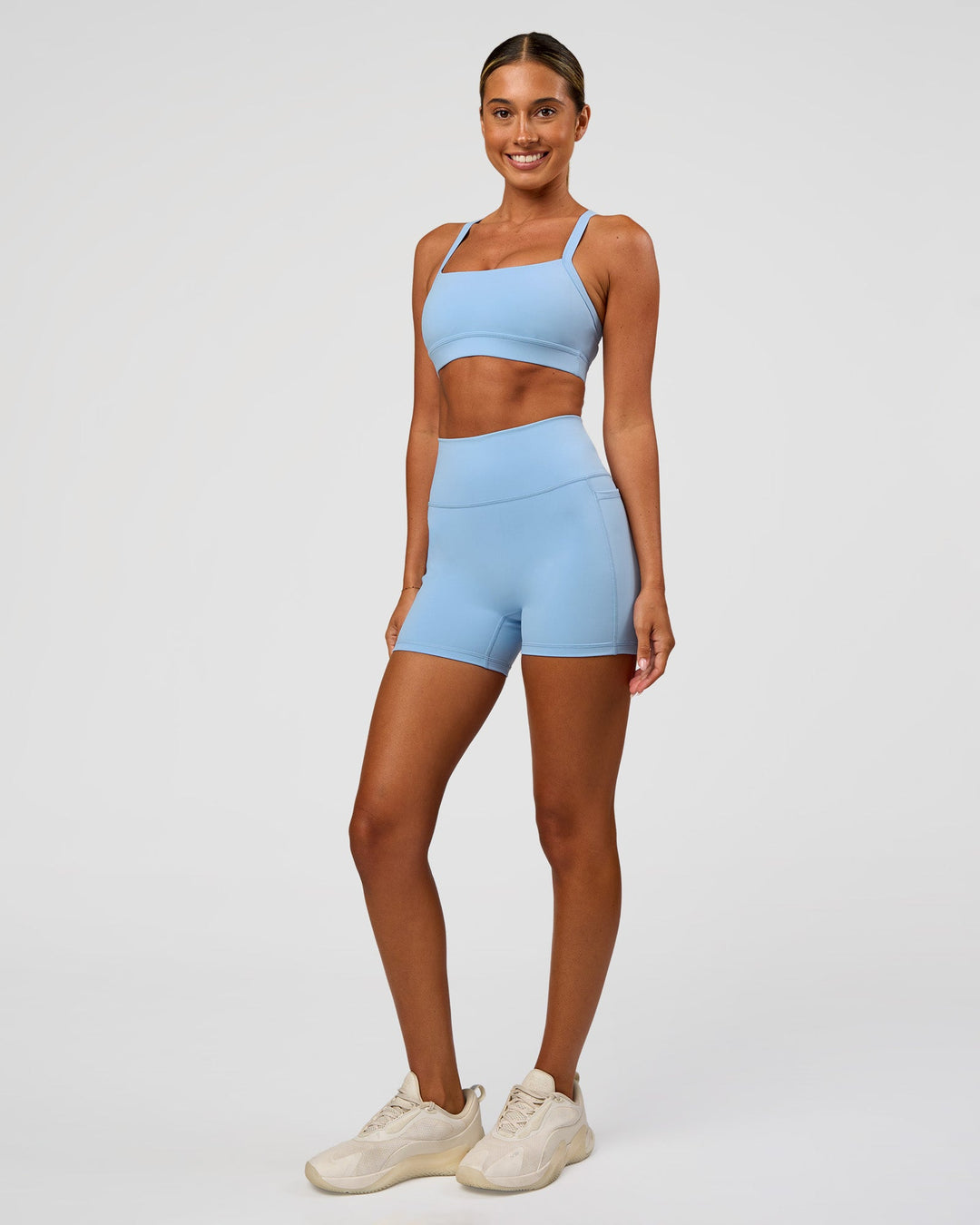 Woman wearing Momentum Sports Bra - Open Air | Model:Charli | Size:XS