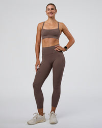 Woman wearing Momentum Sports Bra - Peppercorn | Model:Peppercorn | Size:XS