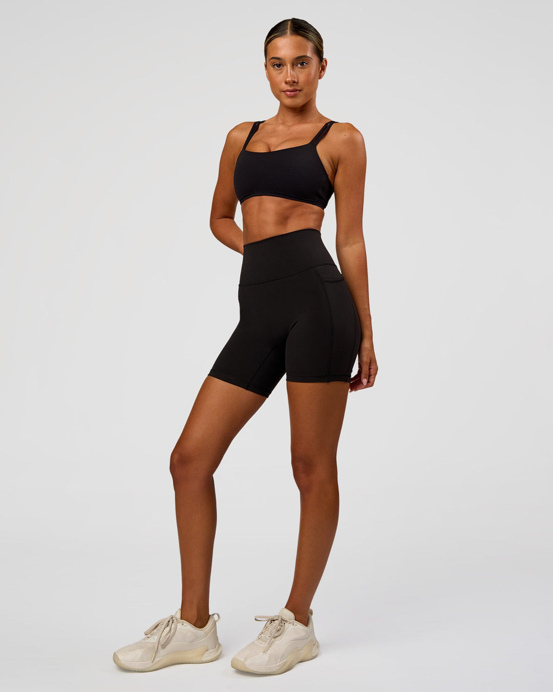 Woman wearing O.G Fusion Ultra High-Rise 6" Short Pockets - Black | Model:Charli | Size:XS