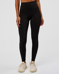 Woman wearing O.G Fusion Ultra High-Rise Full Length Legging Pockets - Black | Model:Charli | Size:XS | Thumbnail Index: 0