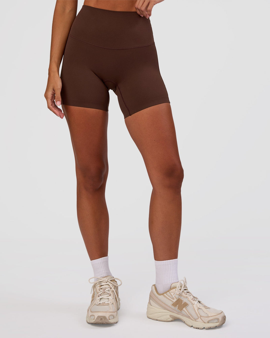 Woman wearing Peaches Elixir High-Rise 6” Short - Hot Chocolate | Model:Brylee | Size:XS