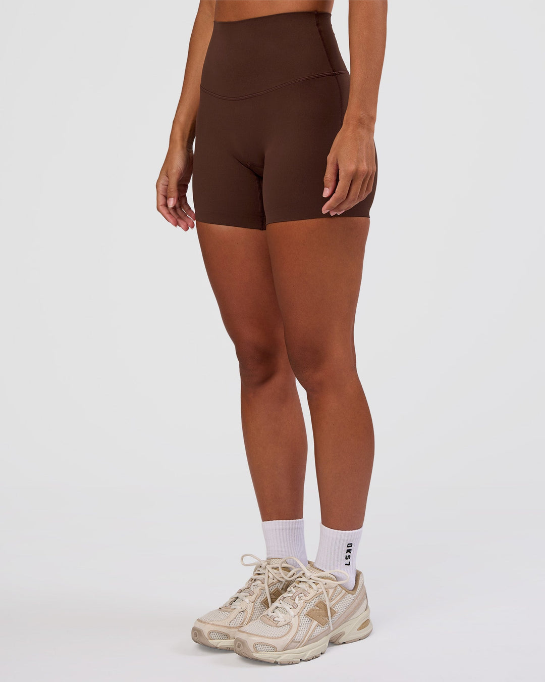Woman wearing Peaches Elixir High-Rise 6” Short - Hot Chocolate | Model:Brylee | Size:XS