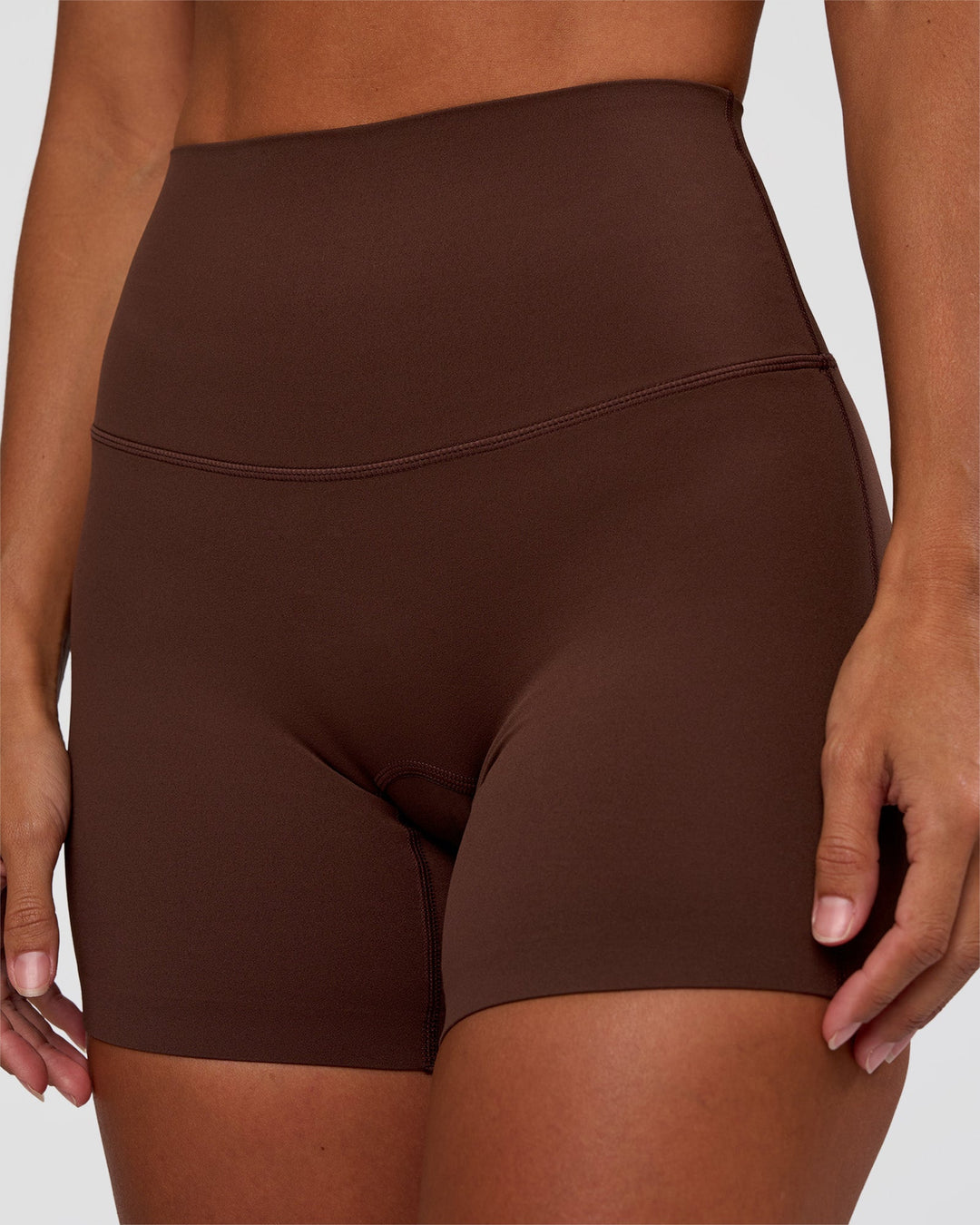 Woman wearing Peaches Elixir High-Rise 6” Short - Hot Chocolate | Model:Brylee | Size:XS
