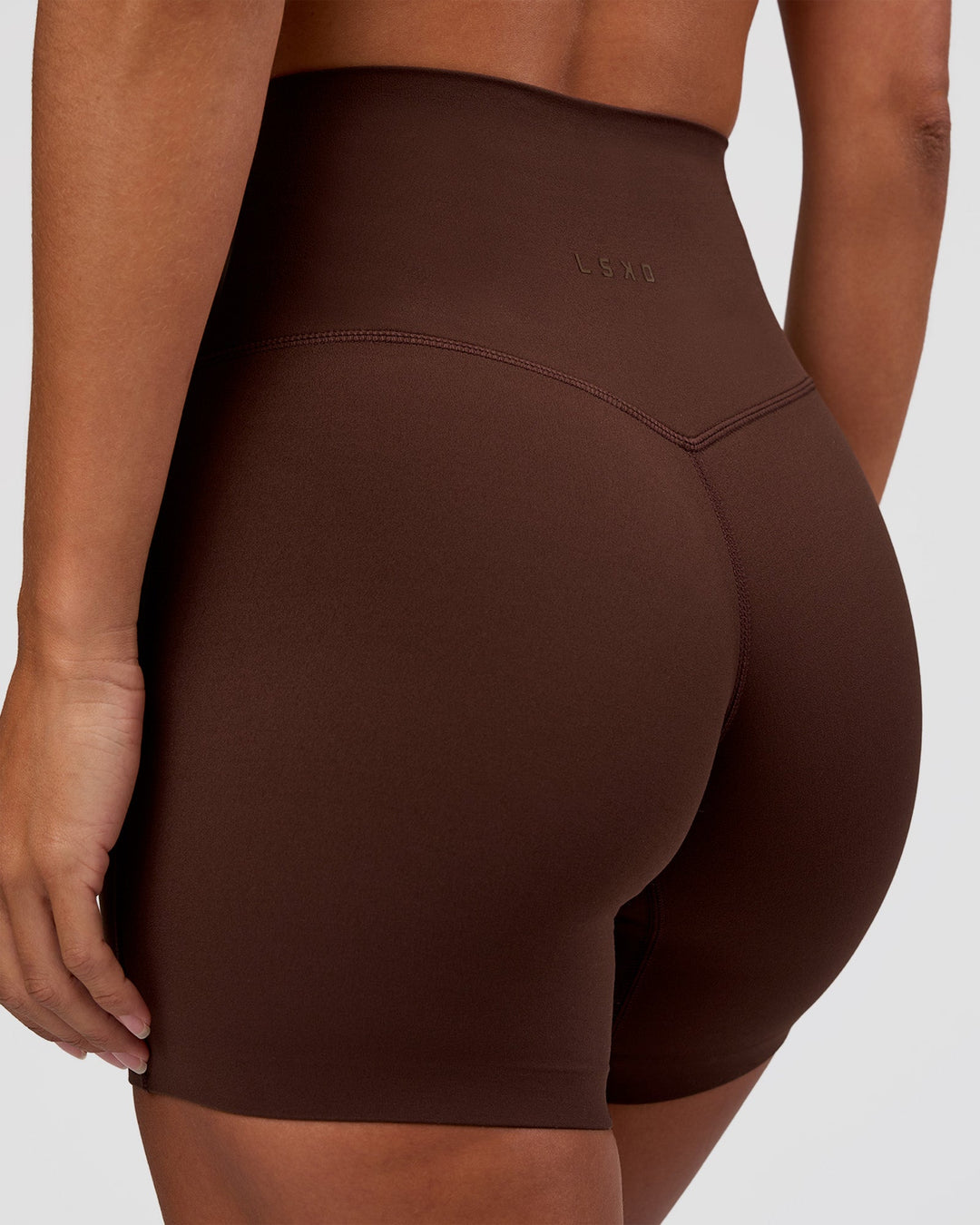 Woman wearing Peaches Elixir High-Rise 6” Short - Hot Chocolate | Model:Brylee | Size:XS
