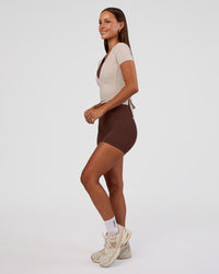 Woman wearing Peaches Elixir High-Rise 6” Short - Hot Chocolate | Model:Brylee | Size:XS