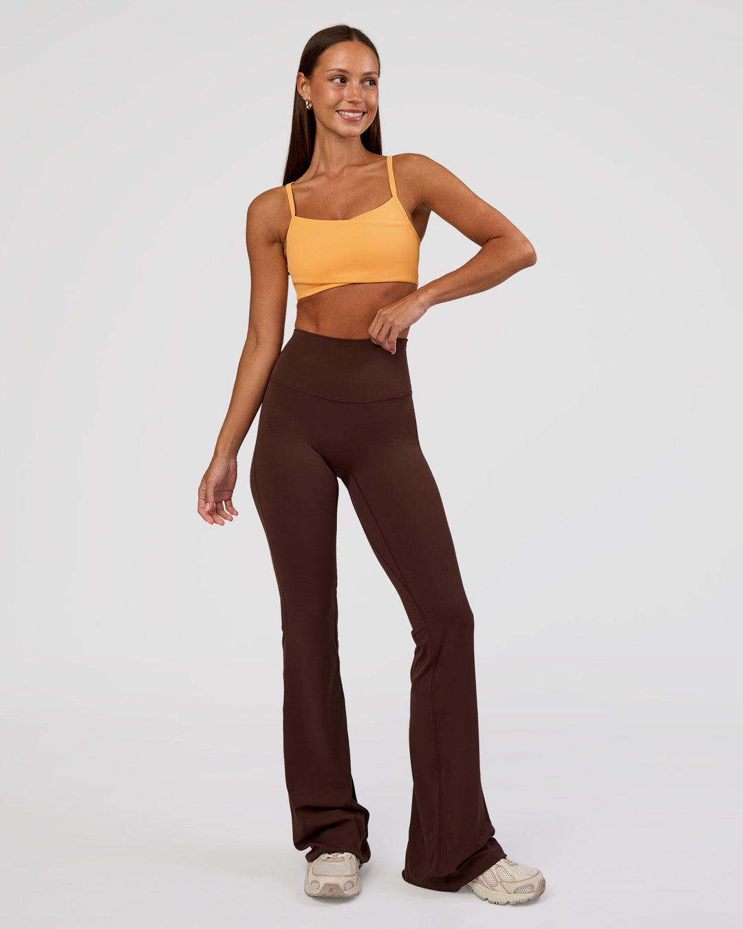 Woman wearing Peaches Elixir High-Rise Flared Pant - Hot Chocolate | Model:Brylee | Size:XS