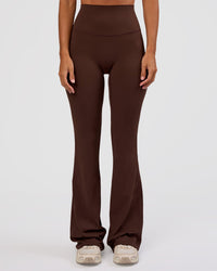Woman wearing Peaches Elixir High-Rise Flared Pant - Hot Chocolate | Model:Brylee | Size:XS