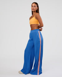 Woman wearing Peaches Track Pant - Palace Blue | Model:Brylee | Size:XS | Thumbnail Index: 5