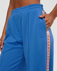Woman wearing Peaches Track Pant - Palace Blue | Model:Brylee | Size:XS | Thumbnail Index: 7