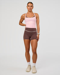 Woman wearing Pinnacle High-Rise 4" Short - Cocoa Powder-Off White | Model:Maja | Size:XS