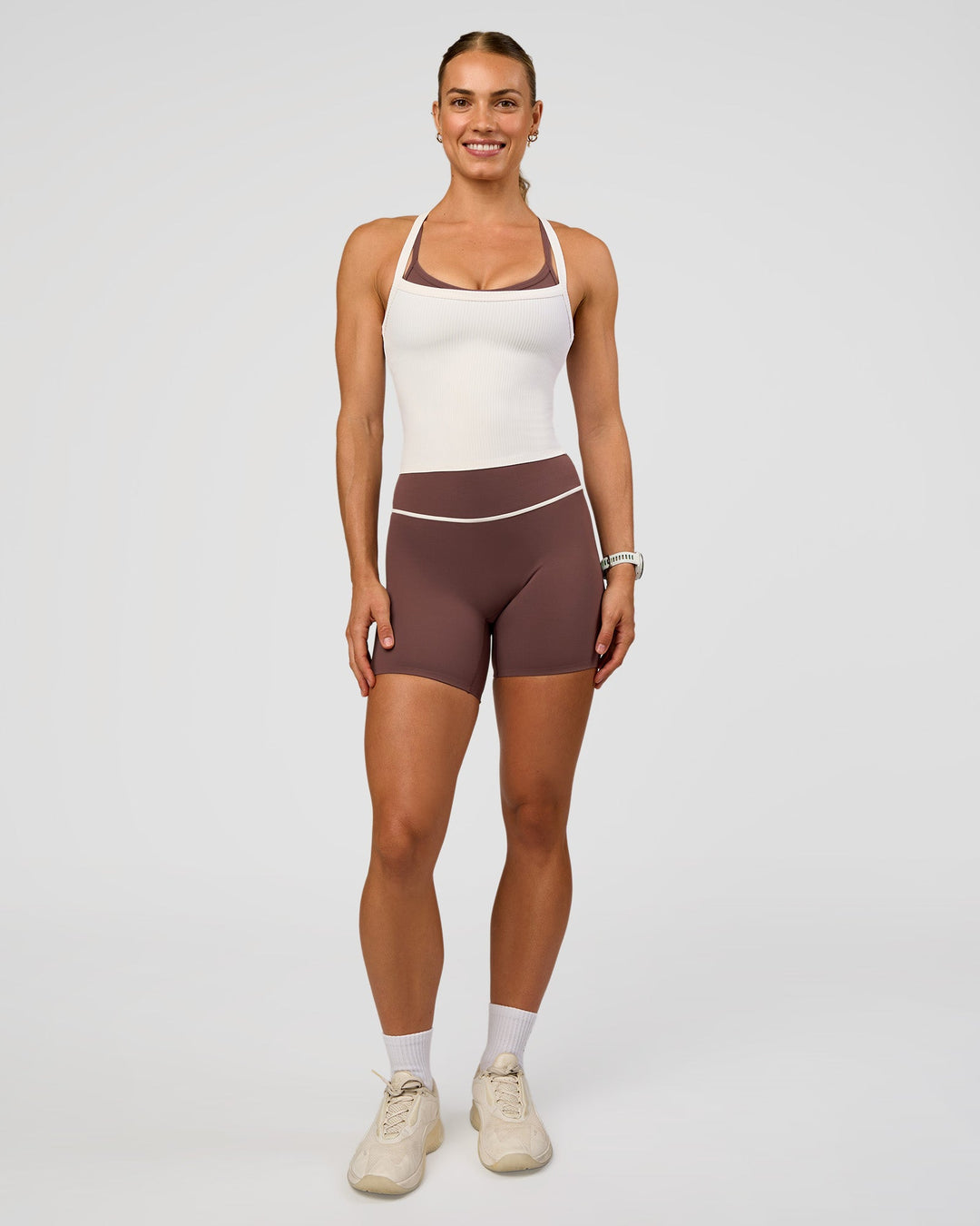 Woman wearing Pinnacle High-Rise 6" Short - Cocoa Powder-Off White | Model:Maja | Size:XS