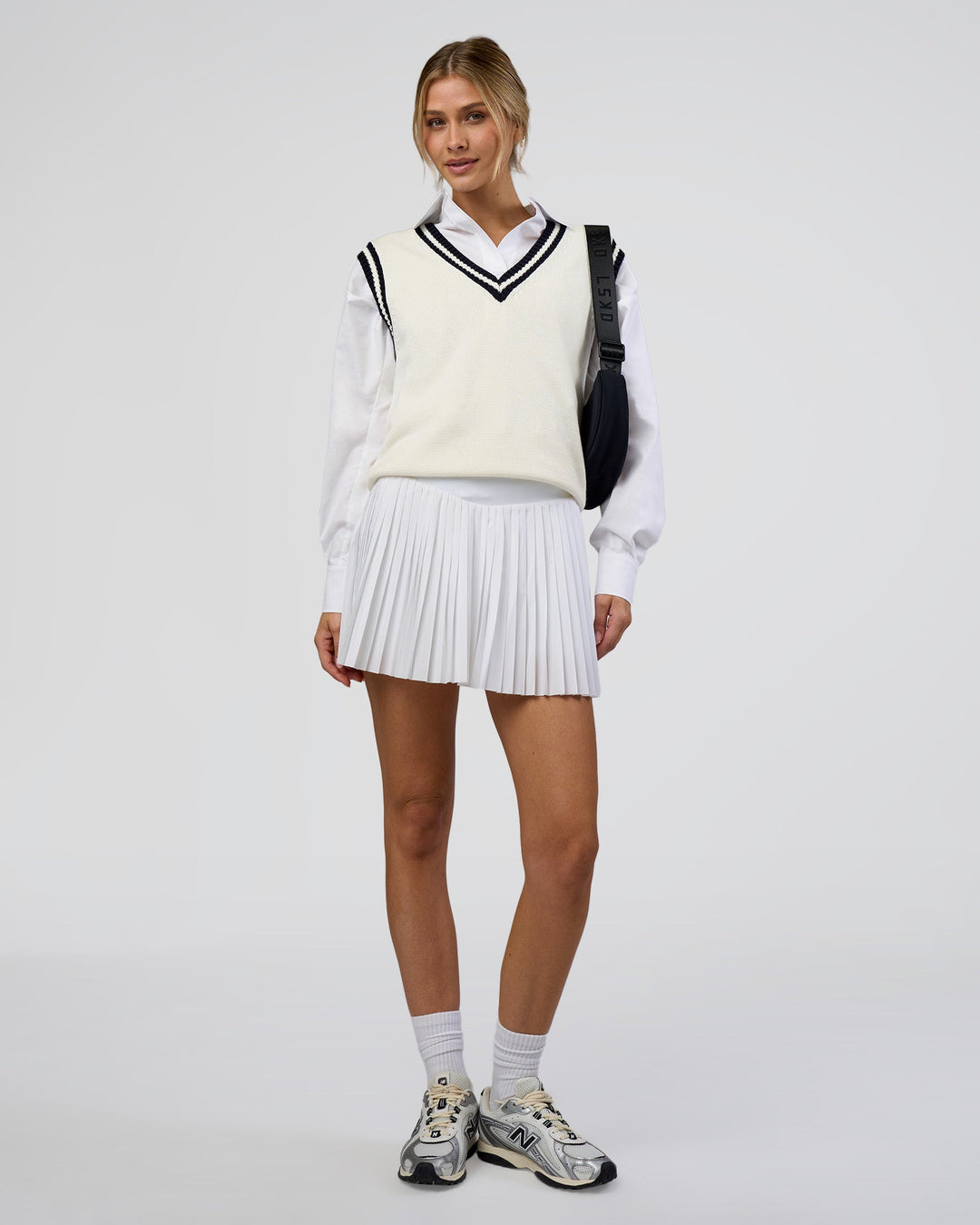 Woman wearing Precision Active Skirt - White | Model:Leilani | Size:XS