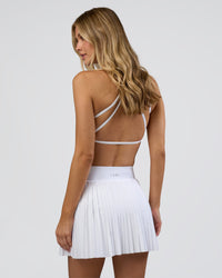 Woman wearing Precision Active Skirt - White | Model:Leilani | Size:XS