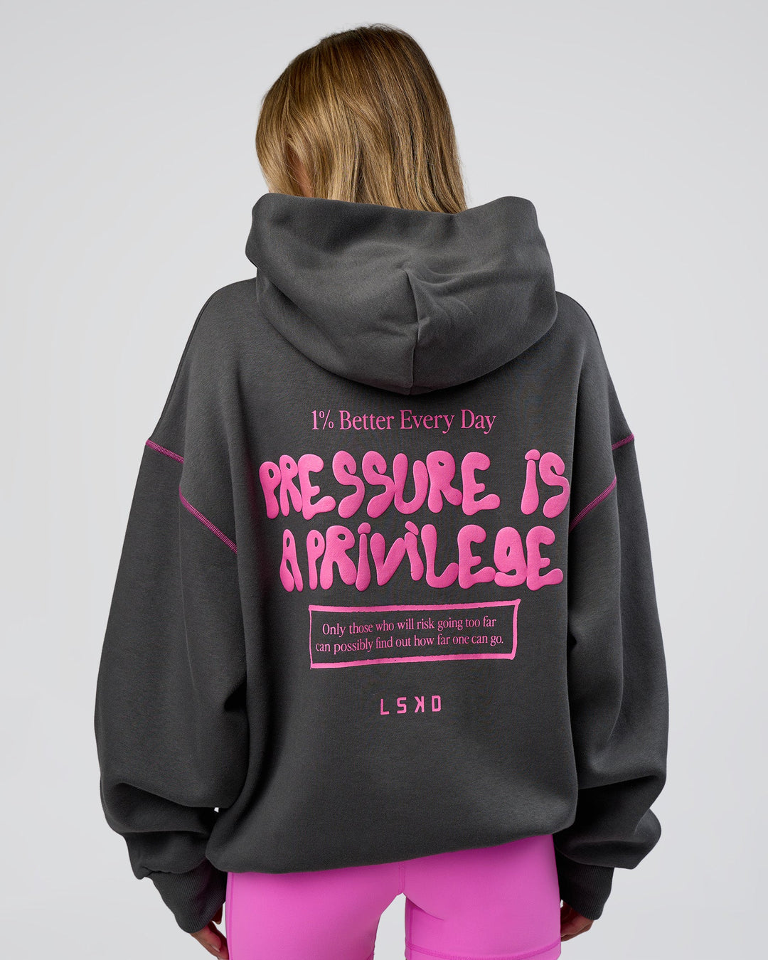 Woman wearing Pressure is Privilege Oversized Hoodie - Dark Storm-Ultra Fuchsia | Model:Leilani | Size:XS