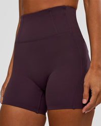 Woman wearing Progression Ultra High-Rise 4" Short - Midnight Plum | Model:Brylee | Size:XS