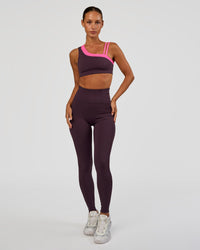 Woman wearing Progression Ultra High-Rise Full Length Legging - Midnight Plum | Model:Brylee | Size:XS