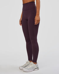 Woman wearing Progression Ultra High-Rise Full Length Legging - Midnight Plum | Model:Brylee | Size:XS