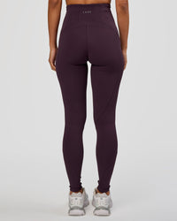 Woman wearing Progression Ultra High-Rise Full Length Legging - Midnight Plum | Model:Brylee | Size:XS