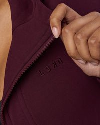 Woman wearing Pursue Mid-Weight Hoodie - Cherry Lacquer | Model:Jordan | Size:XS