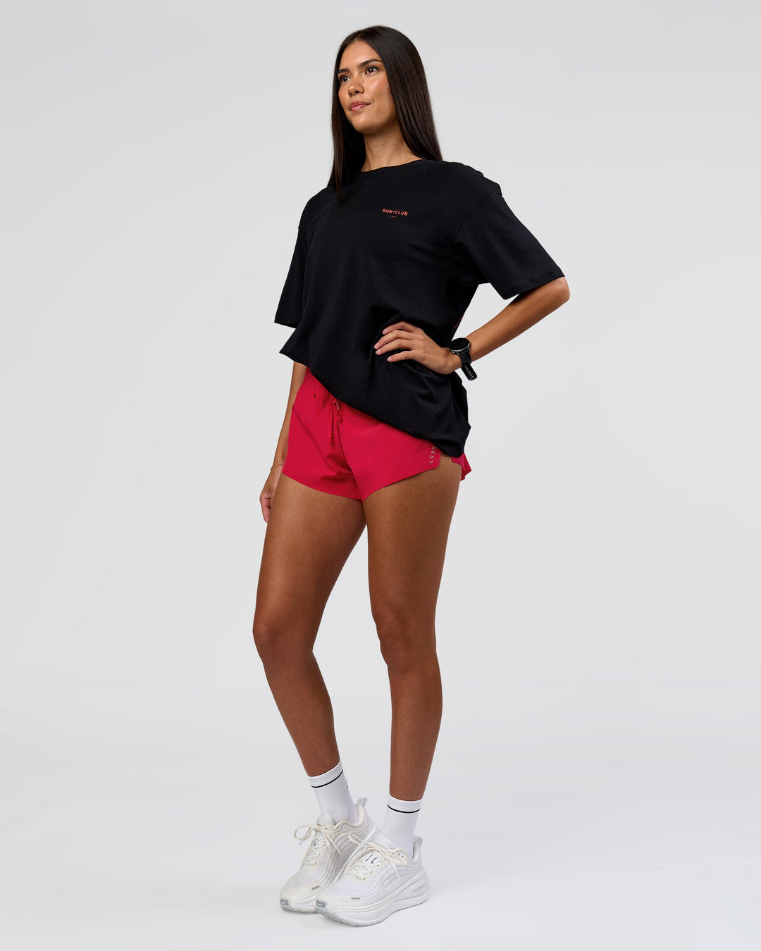 Woman wearing RUN CLUB FLXCotton Tee Oversize - Black-Scarlet | Model:Rhiley | Size:XS