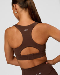 Woman wearing Race Day Sports Bra - Hot Chocolate | Model:Brylee | Size:XS