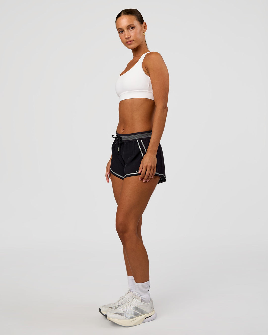 Woman wearing Race Day Sports Bra - White | Model:Brylee | Size:XS