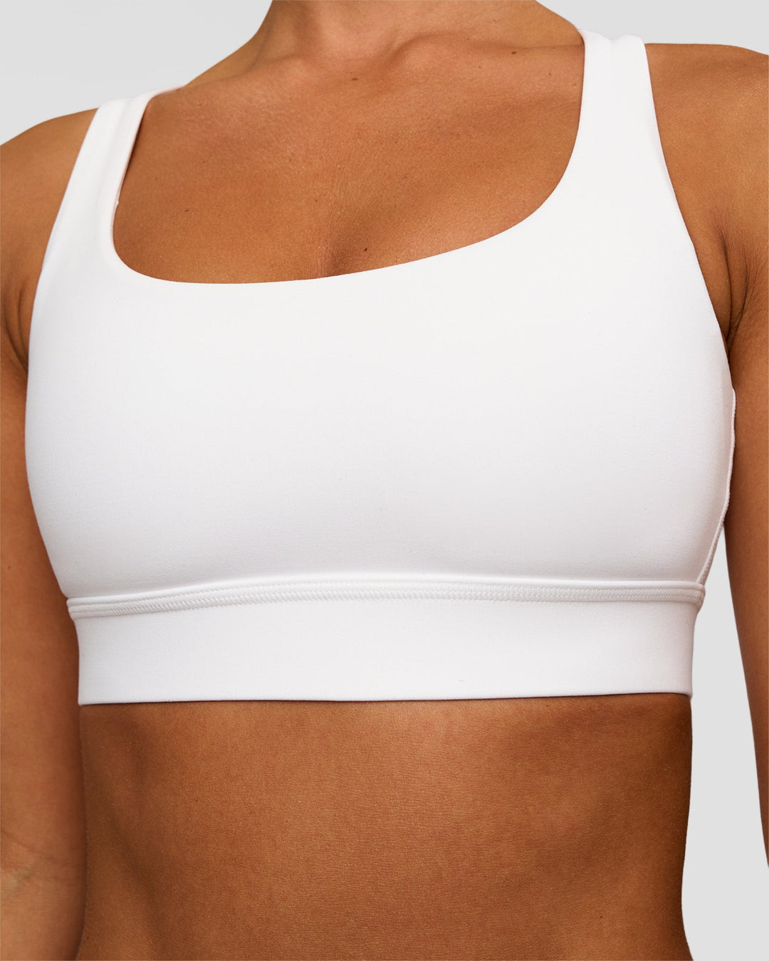 Woman wearing Race Day Sports Bra - White | Model:Brylee | Size:XS