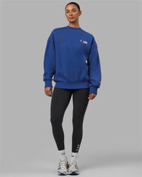 Woman wearing Unisex Redline Sweater Oversize - Power Cobalt-White