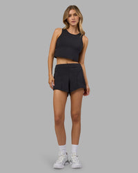 Woman wearing Restore CloudFLX Tank - Black | Model:Leilani | Size:XS