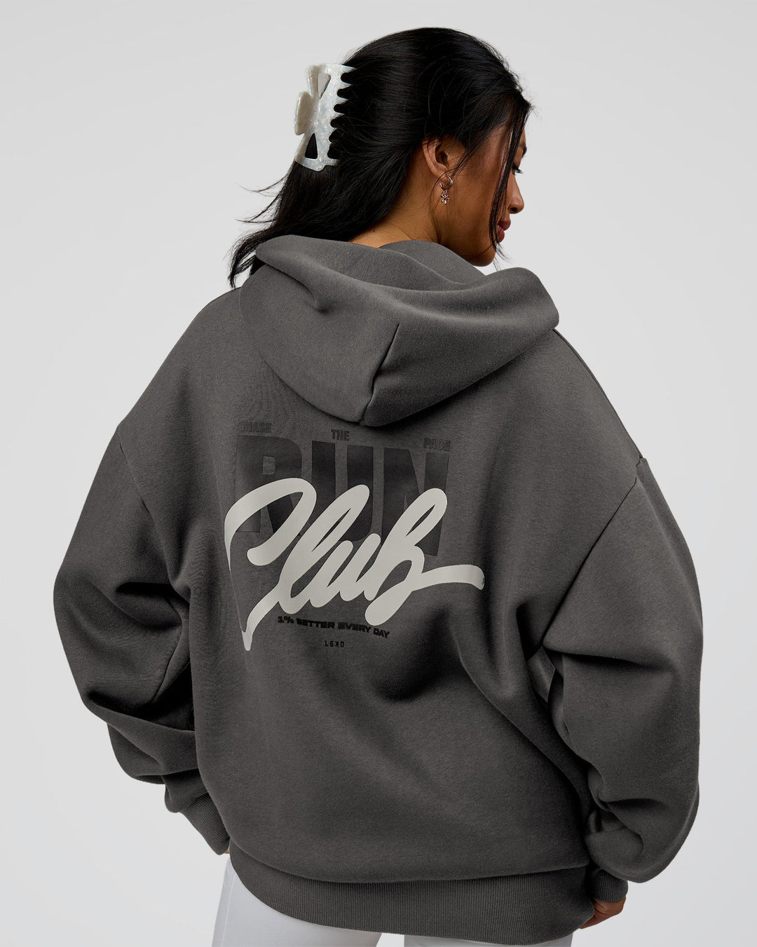 Woman wearing Run Club Script Oversized Hoodie - Dark Storm-Alloy | Model:Loren | Size:XS