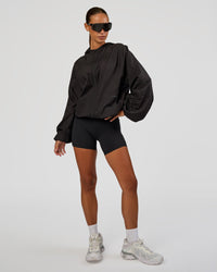 Woman wearing Run Light Jacket - Black | Model:Brylee | Size:XS