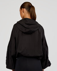 Woman wearing Run Light Jacket - Black | Model:Brylee | Size:XS