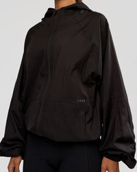 Woman wearing Run Light Jacket - Black | Model:Brylee | Size:XS
