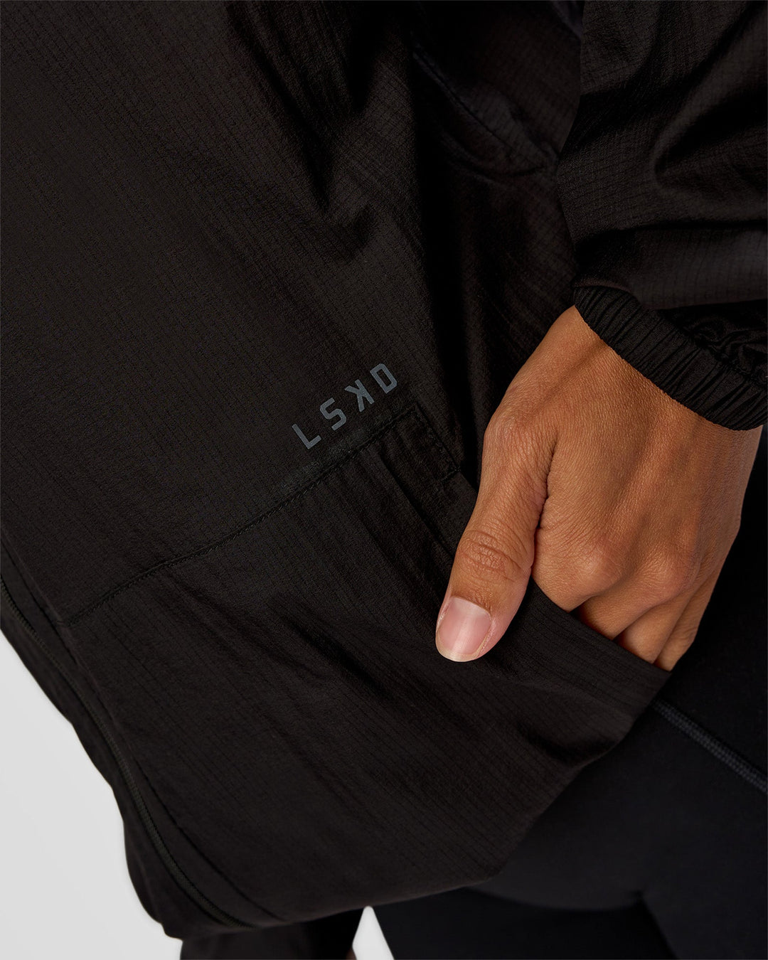 Woman wearing Run Light Jacket - Black | Model:Brylee | Size:XS