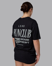 Woman wearing Run Love FLXCotton Oversized Tee - Black-Reflective | Model:Sav | Size:XS